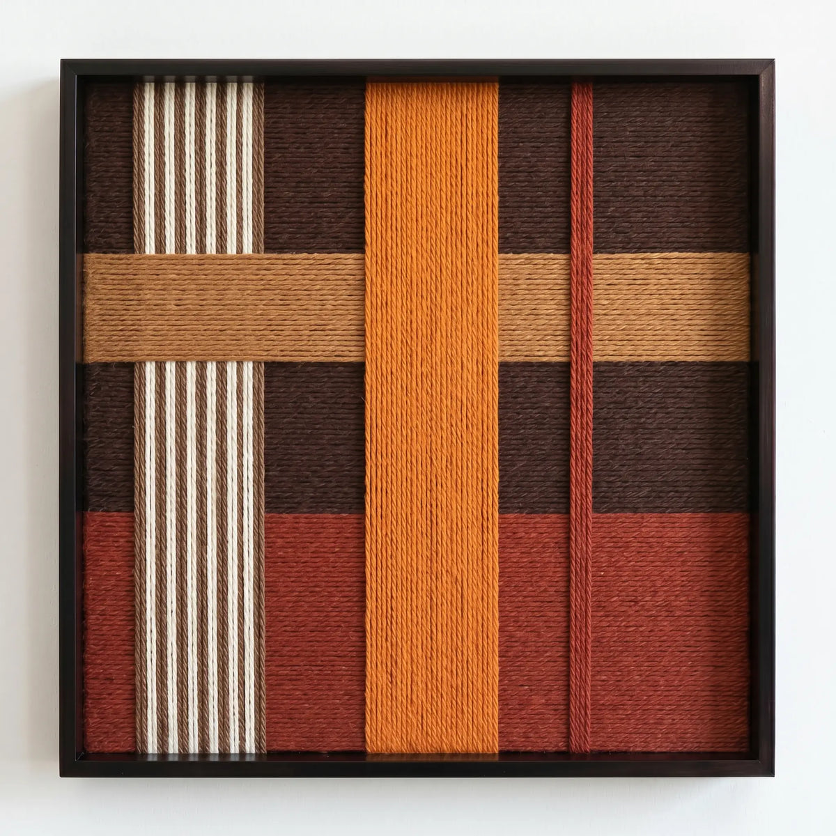 Professional studio shot of the Sunlit Symphony hand-woven fiber art against a clean white background, showcasing earth-toned geometric patterns.