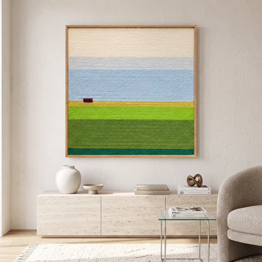 Contemporary living room interior featuring the hand-woven wool tapestry hanging above a sleek credenza with minimalist decor elements.