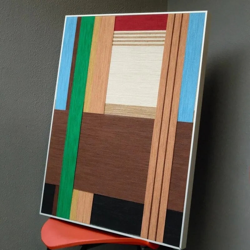 Angled close-up of Wild yarn wall art highlighting tight stitch detail of premium wool and crisp transitions between earth-stripe colors
