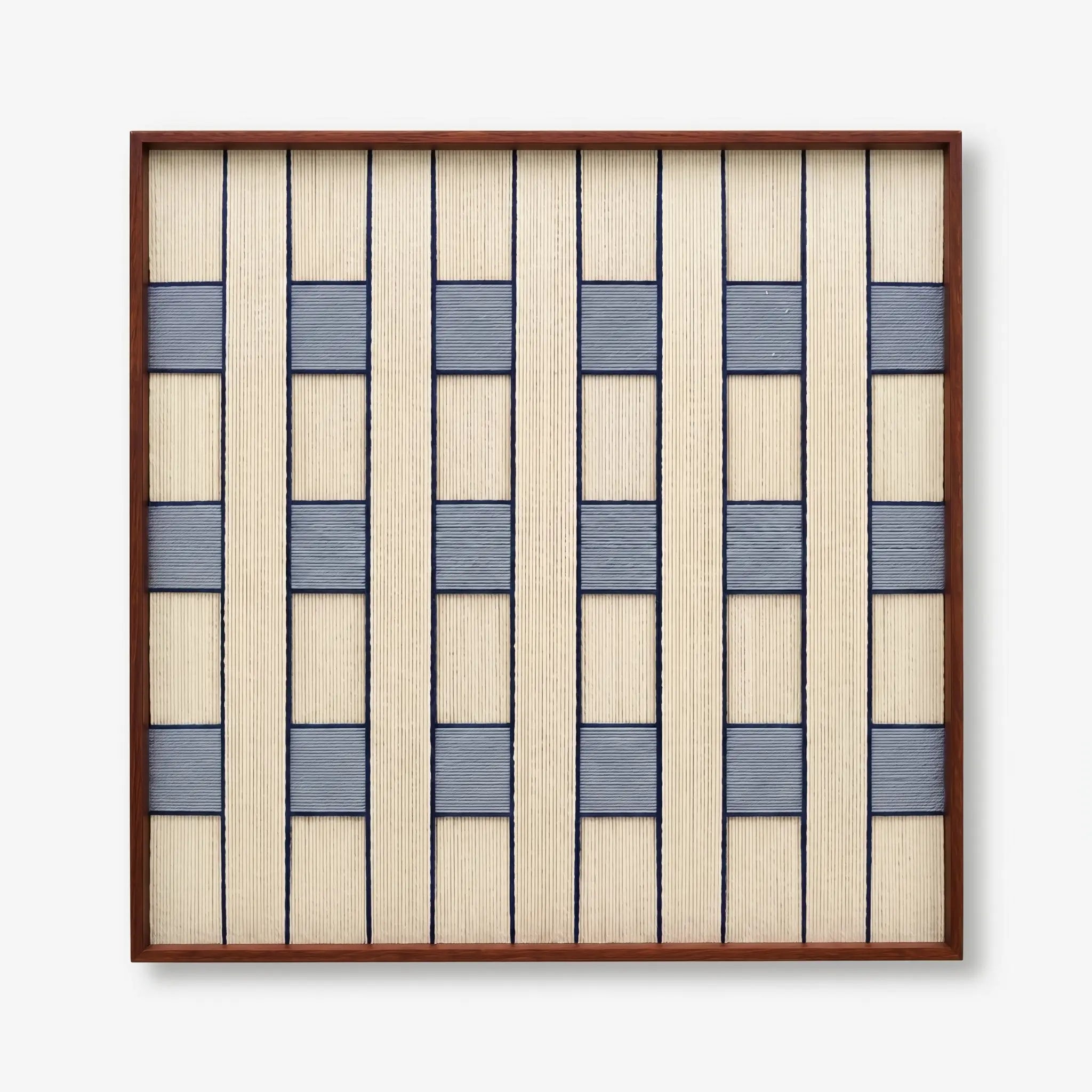 Professional studio shot of the Winter Stationery hand-woven wool wall art in a dark wood frame against a white background.