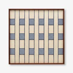 Professional studio shot of the Winter Stationery hand-woven wool wall art in a dark wood frame against a white background.